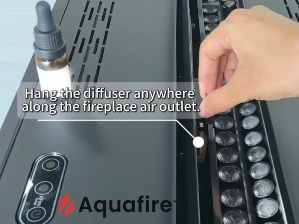 Positionnement du diffuseur de parfum Aquafire dans la sortie d'air de la cheminée à vapeur d'eau